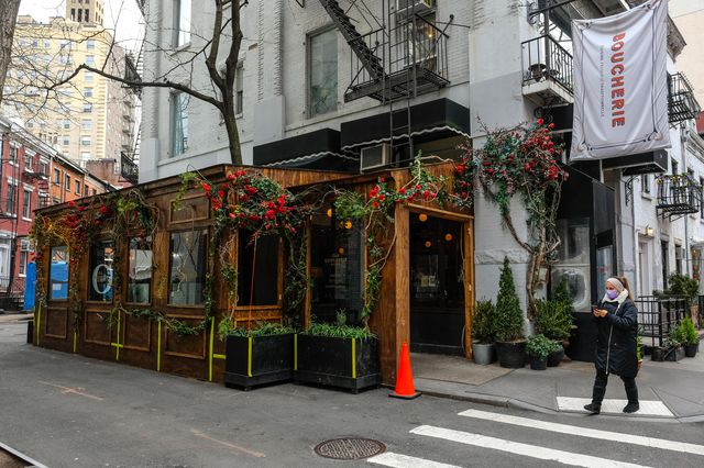 An elaborate wood paneled outdoor dining set up in the west Village